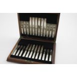 A GEORGE VI CASED SET OF TWELVE PAIRS OF MOTHER OF PEARL-HANDLED FRUIT KNIVES AND FORKS