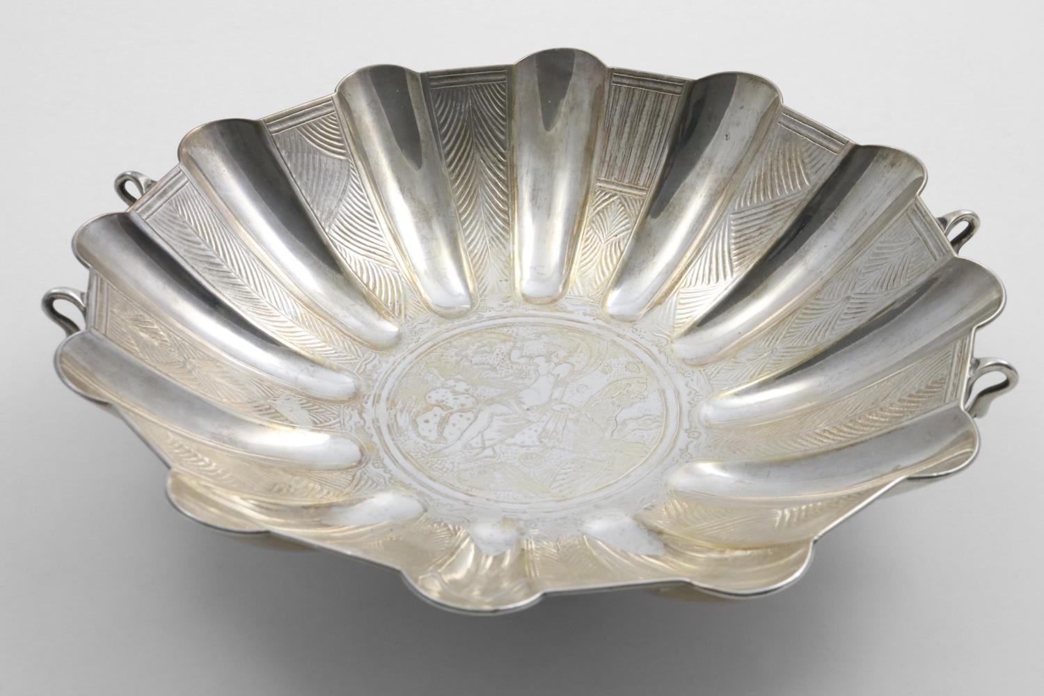 A SCOTTISH SCALLOPED CIRCULAR DISH with part polished and part textured decoration inside and 4