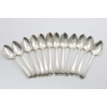 A SET OF TWELVE GEORGE III OLD ENGLISH PATTERN DESSERT SPOONS initialled, by Messrs Eley. Fearn