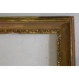 A `CARLO MARATTA` TYPE GILTWOOD PICTURE FRAME with stylised leaf sight edge To fit 55.5 x 76cm.