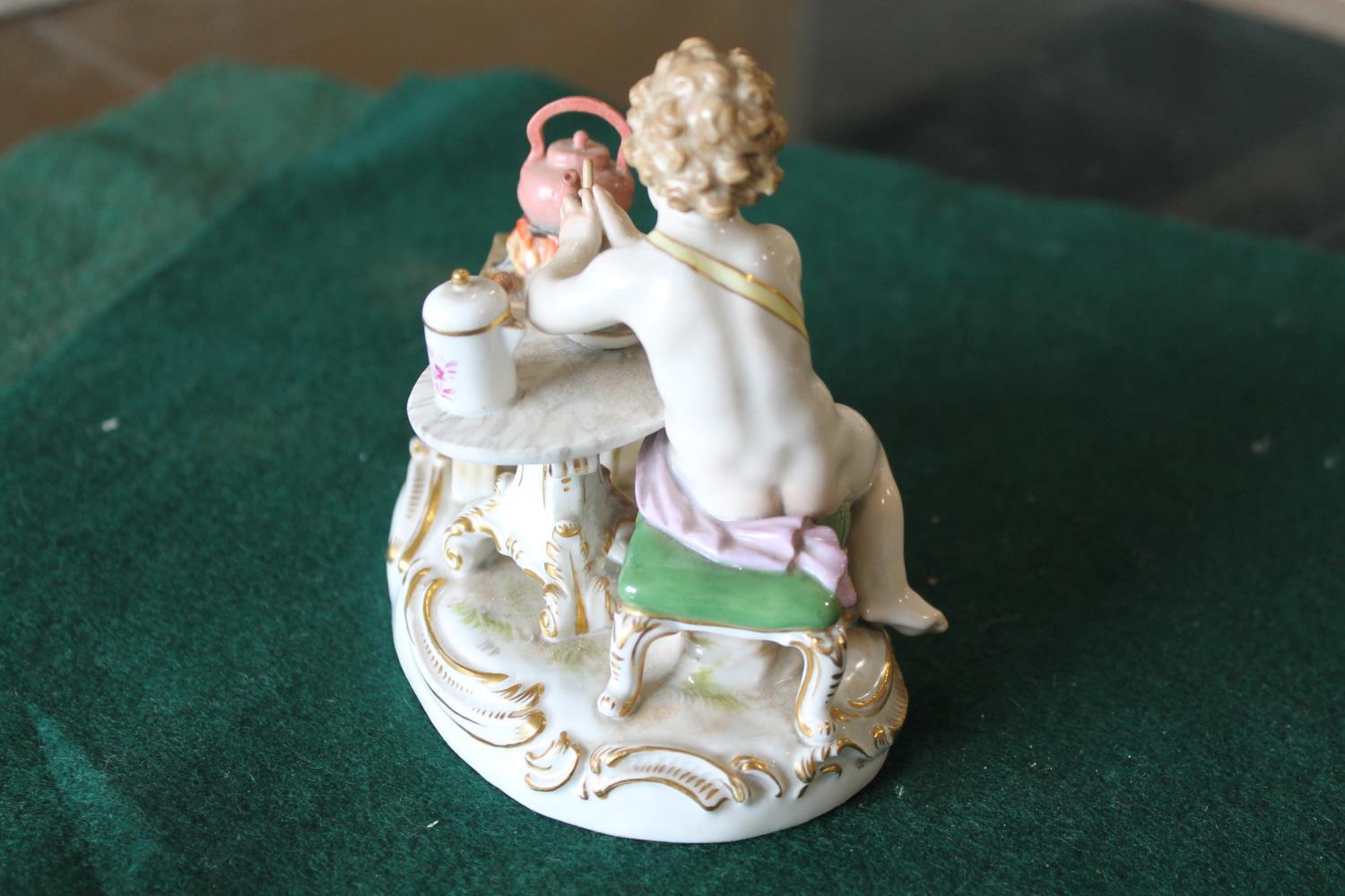 MEISSEN FIGURE a porcelain figure of a cherub mixing a drink, with a brazier and a kettle on a fire, - Image 10 of 13