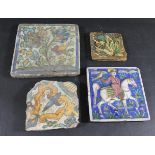 PERSIAN TILES including a Qajar style tile, painted with a falconer on horseback with a bird on