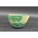 DEVEZ CAMEO GLASS BOWL of squat tapering form with a gently curving rim, cased in a dark green glass