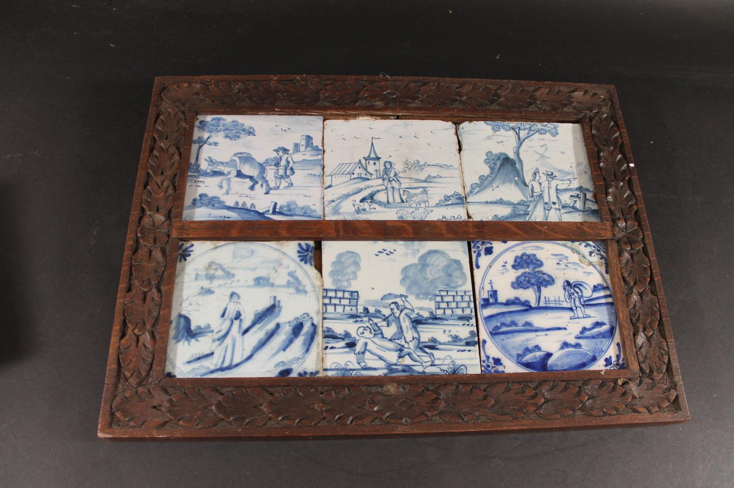 FRAMED DELFT BLUE & WHITE TILES six 18thc delft tiles, each painted with a variety of figures within