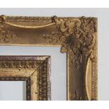 A DECORATIVE SMALL PICTURE FRAME with stylised acanthus leaf motifs, leafy scrolls and smaller