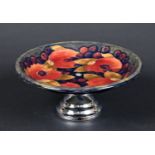 MOORCROFT TAZZA - POMEGRANATE a William Moorcroft tazza, in the Pomegranate design on a blue