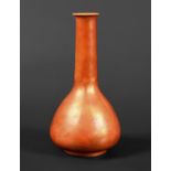 RUSKIN VASE the vase with a narrow tapering neck and bulbous body, and with a orange lustre glaze.