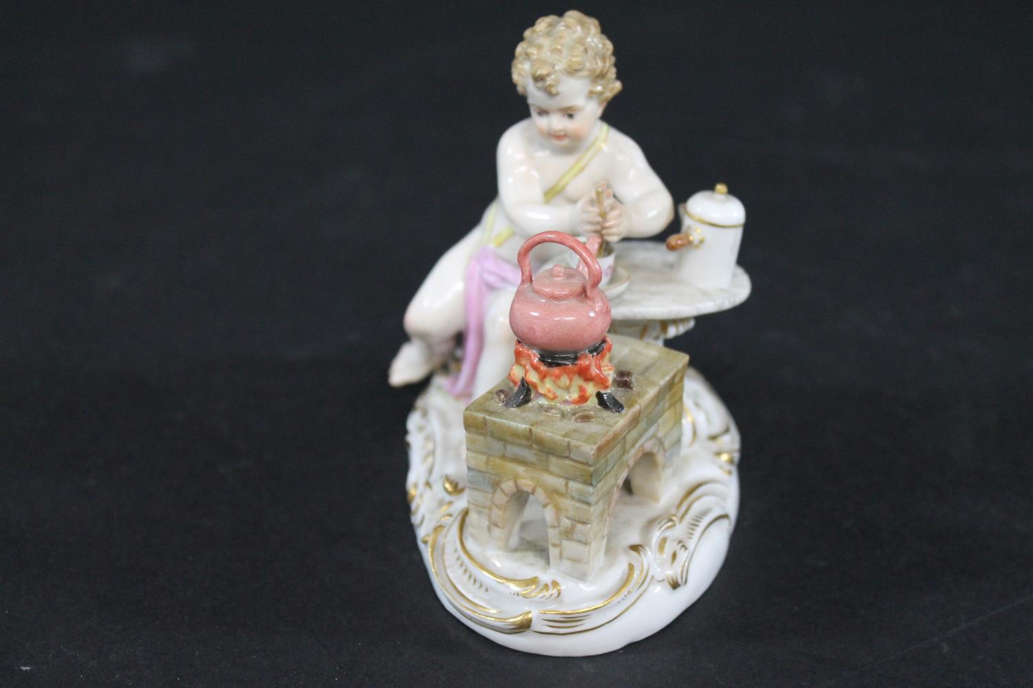 MEISSEN FIGURE a porcelain figure of a cherub mixing a drink, with a brazier and a kettle on a fire, - Image 5 of 13