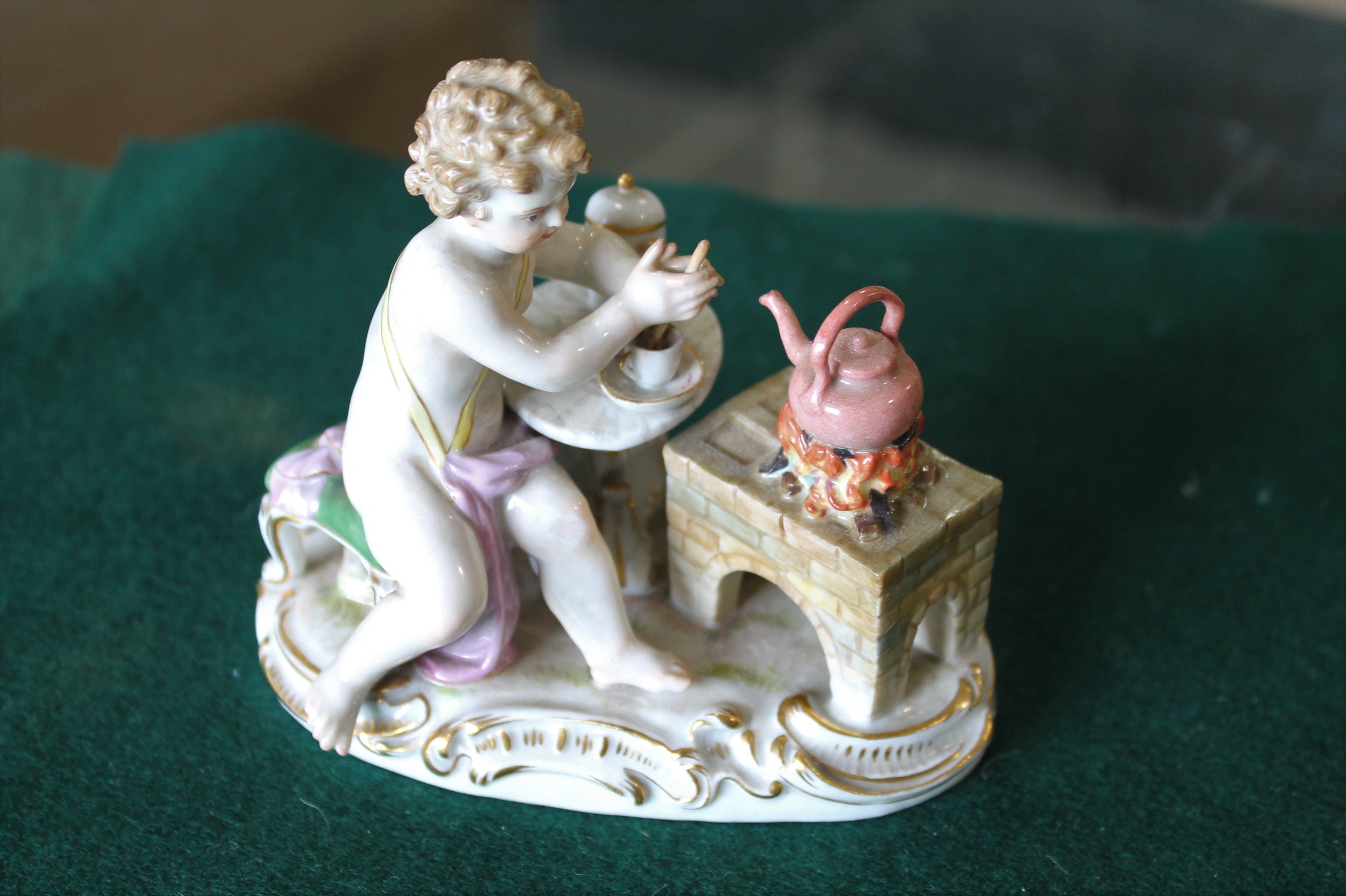 MEISSEN FIGURE a porcelain figure of a cherub mixing a drink, with a brazier and a kettle on a fire, - Image 7 of 13