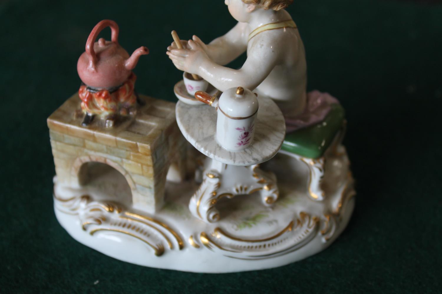MEISSEN FIGURE a porcelain figure of a cherub mixing a drink, with a brazier and a kettle on a fire, - Image 9 of 13