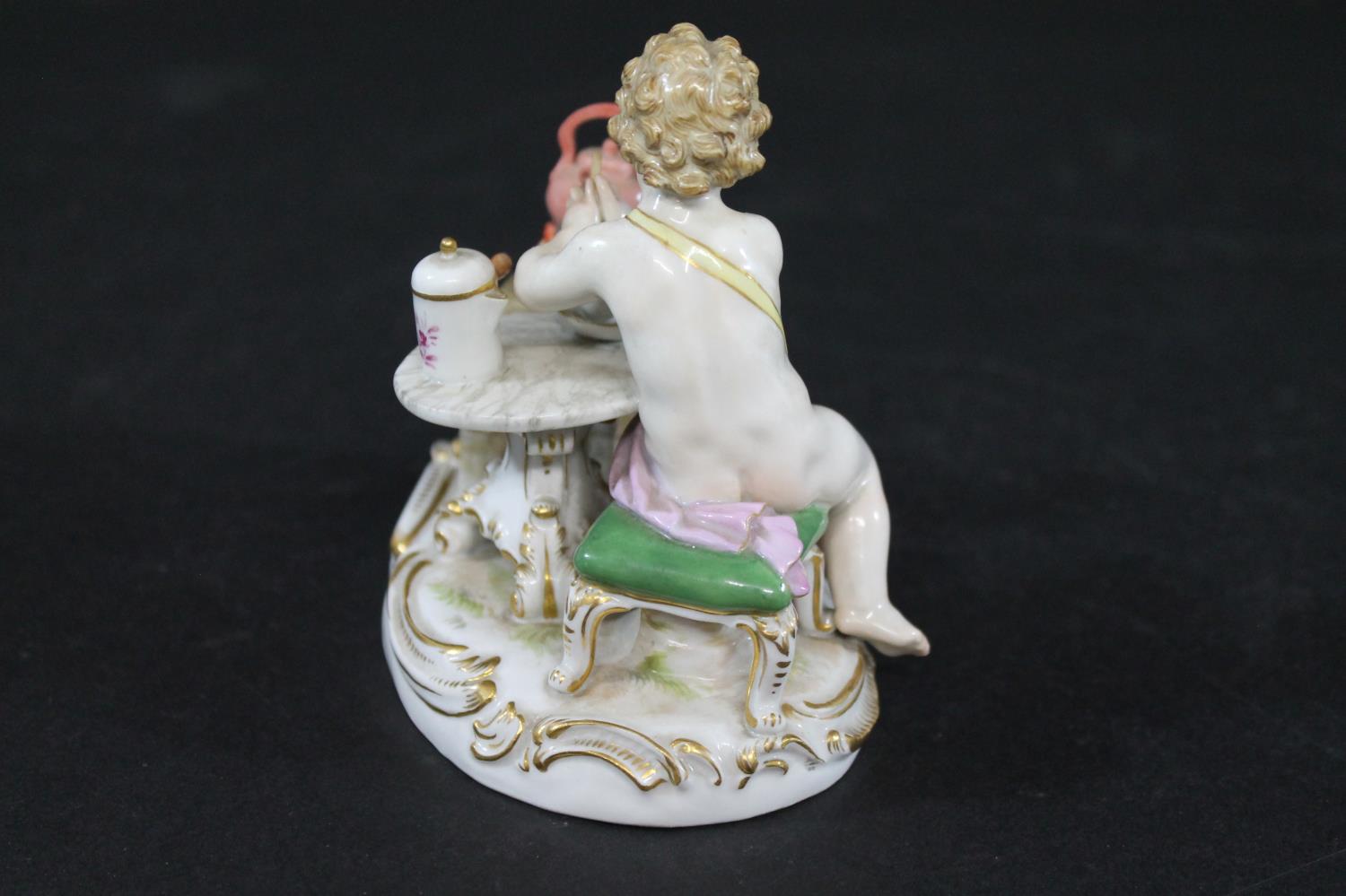 MEISSEN FIGURE a porcelain figure of a cherub mixing a drink, with a brazier and a kettle on a fire, - Image 4 of 13