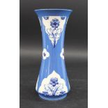 MOORCROFT VASE - FORGET ME NOT a slender vase painted with panels of forget-me-nots on a powder blue