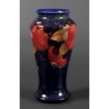 MOORCROFT VASE - POMEGRANATE a William Moorcroft vase, the tall slender vase in the Pomegranate