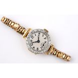 A LADY'S DIAMOND COCKTAIL WRISTWATCH the circular white enamel dial with black Arabic numerals,