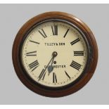 A MAHOGANY CIRCULAR WALL CLOCK, the 10" cream dial signed Tilley & Son, Dorchester, on a brass fusee