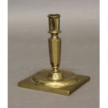 A SPANISH BRASS SHIP'S CANDLESTICK, late 18th century, the tapering stem screwing into a circular