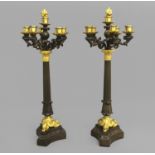 A PAIR OF EARLY 19TH CENTURY BRONZE AND GILT BRONZE CANDELABRA, with five scrolling branches and a