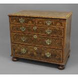 A WILLIAM AND MARY OYSTER VENEERED CHEST OF DRAWERS, the moulded top with a concentric circle design