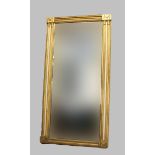 A GILT WOOD OVERMANTEL MIRROR, the rectangular plate with beaded border flanked by Corinthian