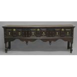 AN OAK DRESSER BASE OF CHARLES II DESIGN the three drawers with geometrically moulded fronts