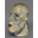 PATRICIA VOLK (b.1951); a large studio pottery study of a human head, tinted with red and blue,