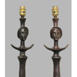 AFTER ALBERTO GIACOMETTI, a pair of Tête De Femme design brown patinated bronze figural floor lamps,