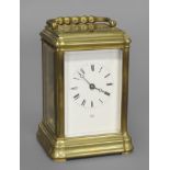 A BRASS CARRIAGE CLOCK BY DENT OF LONDON, the dial signed Dent, London, on a brass repeating