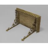 A PUGINESQUE GILT METAL WALL BRACKET, the rectangular top above an arcaded Gothic style gallery on