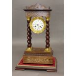A 19TH CENTURY FRENCH PORTICO CLOCK, the 3 1/2" dial on a brass movement stamped 7191 striking to