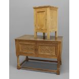 A 1920'S CEDAR WOOD SUITE, comprising a chest with two carved doors on turned supports, a