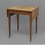A REGENCY AMBOYNA PEMBROKE TABLE, with single frieze drawer and faux reverse drawer, on tapering