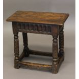 A CARVED OAK JOINT STOOL, 19th century in the 17th century style, the rectangular top with moulded