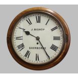 A 19TH CENTURY MAHOGANY WALL CLOCK, the 12" circular dial signed J. Bishop, Sherborne, on a brass
