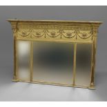 A 19TH CENTURY GILT OVERMANTEL MIRROR, the frieze with ribbon and harebell swag decoration above