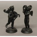 A PAIR OF ITALIAN BRONZE PUTTI, taming a swan and a dolphin, on circular bases, height of tallest
