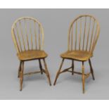 A PAIR OF AMERICAN HOOP BACK CHAIRS, with shaped saddle seats on turned supports, traces of green