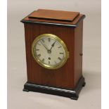 A MAHOGANY CASED MANTEL CLOCK, the 4 3/4" silvered dial with Roman numerals on a brass fusee