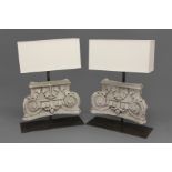 A PAIR OF CONTEMPORARY CORINTHIAN CAPITAL LAMPS, of plaster construction on a heavy metal base and