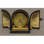 AN EARLY 20TH CENTURY GILT ALARM CLOCK, Swiss made, the dial signed W.A Perry & Co, Birmingham, in