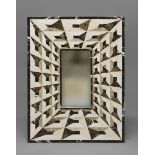 A SPECIMEN MARBLE WALL MIRROR, of rectangular form with a small central plate surrounded by a