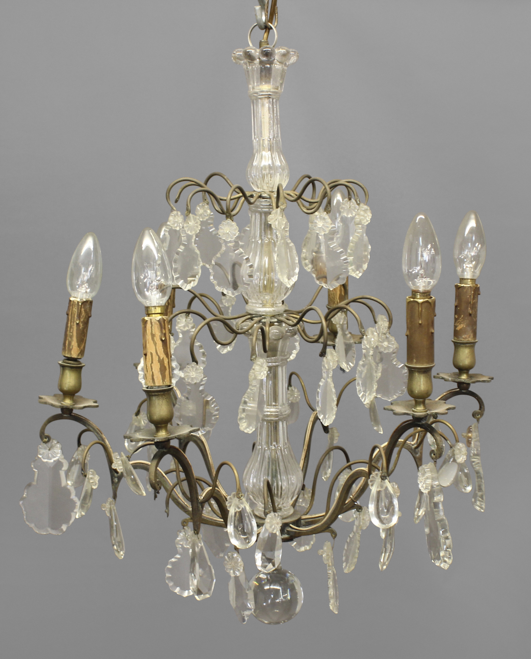 A 19TH CENTURY CRYSTAL SIX BRANCH CHANDELIER, the cut glass stem in three baluster form sections