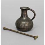 A BRONZE APOTHECARY FLASK, possibly 16th century, with a flared rim and loop handle potentially