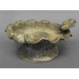 A LEAD BIRD BATH, of shell form with a bird seated on the edge, height 19cm, width 38cm