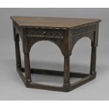 A JAMES I OAK SIDETABLE with angled sides and frieze drawer with geometric carved band
