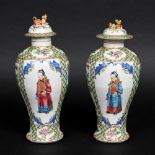 PAIR OF CHINESE FAMILLE ROSE VASES. A pair of 19thc baluster vases, each painted with a Court figure