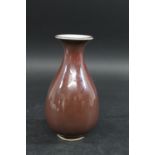 CHINESE PORCELAIN VASE. Probably 19thc, the pear shaped vase with a copper red glaze. Unmarked,