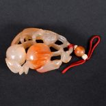 CHINESE CARVED AGATE PENDANT. A 19thc agate pendant, carved with an animal figure possibly a Fox,