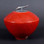 TIM ANDREWS (B 1960) - RAKU LIDDED JAR. (d) A conical raku jar with a horn shaped finial and red