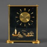 JAEGER LE COULTRE 'MARINA' CLOCK. A rectangular shaped clock with a lucite case and brass edges