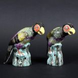 PAIR OF CHINESE PORCELAIN PARROTS. A pair of brightly painted porcelain Parrots, each perched on a